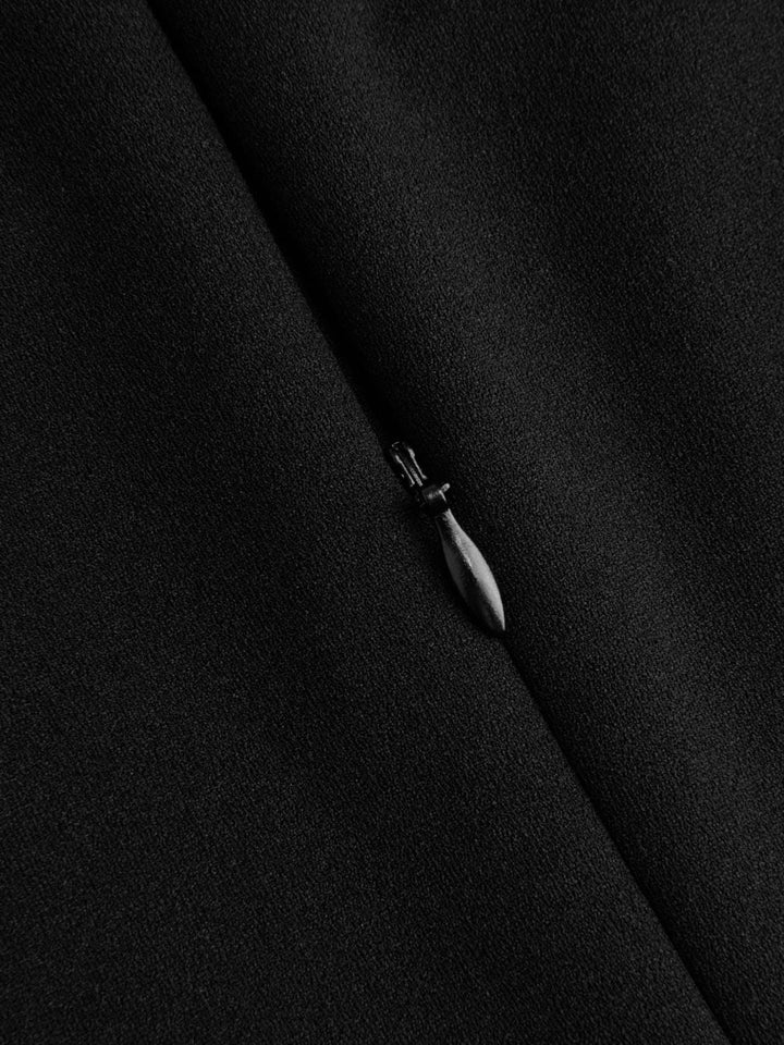 Combinaison à encolure haute, découpée, avec jambes larges