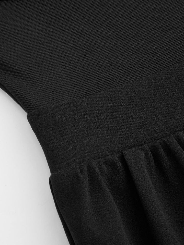 Combinaison à encolure haute, découpée, avec jambes larges